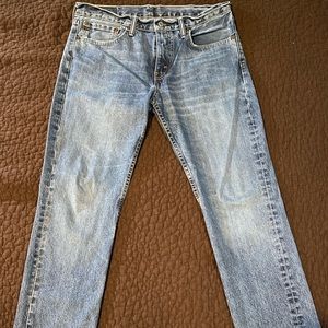 Levi’s 511 faded blue jeans. No major rips, snags or tears. Size is 34 x 32.